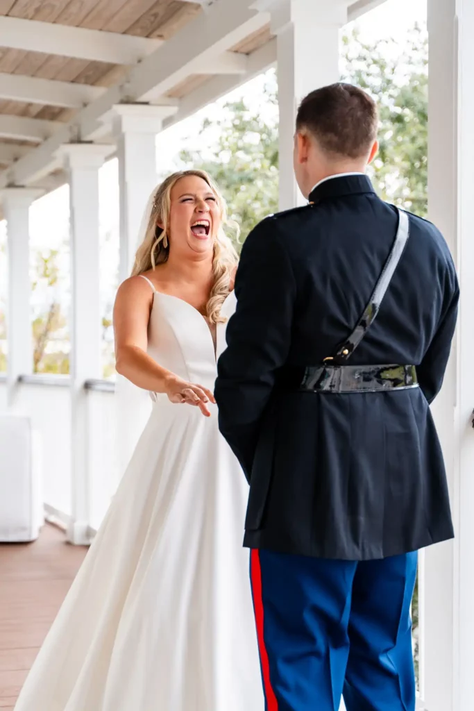 groom in dress blues first look at bride in white dress