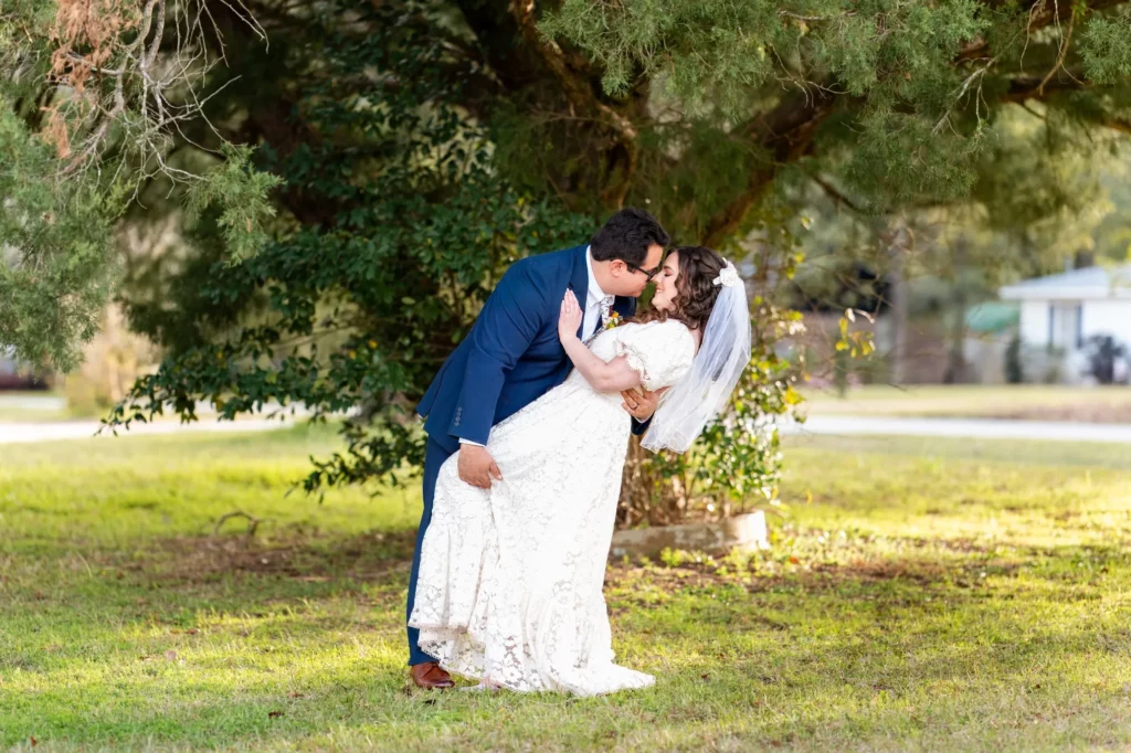 kiss as husband and wife during intimate church ceremony in Semmes