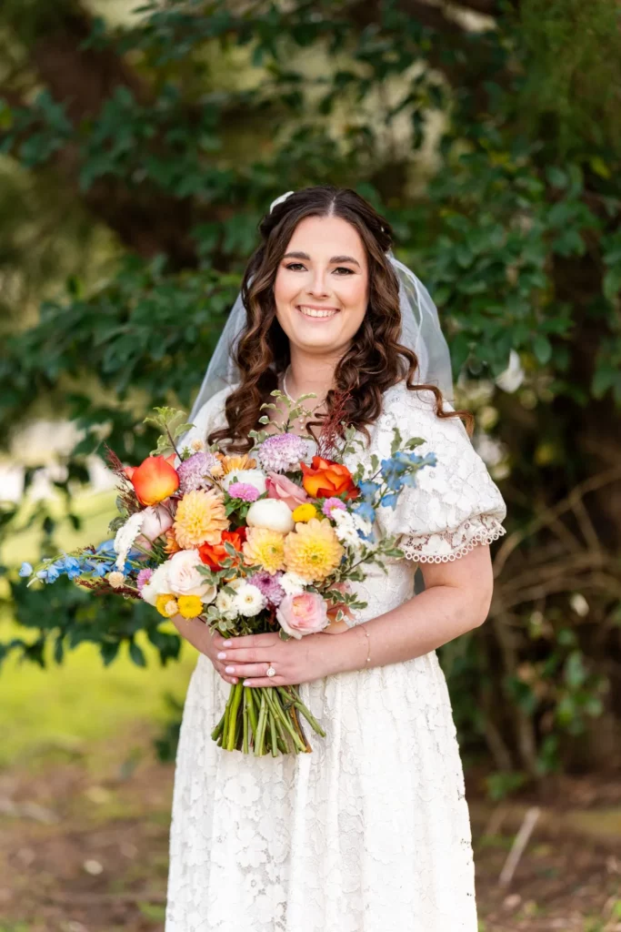 wedding dress and Wedding bouquet by Floral Tree Affairs with white and blush roses