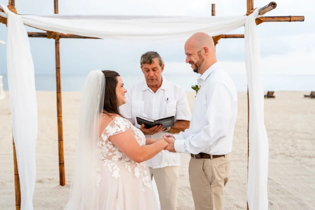Panama City Beach Wedding Photographer 2 Chad & Rena holding hands about to get married under a canopy on Orange Beach