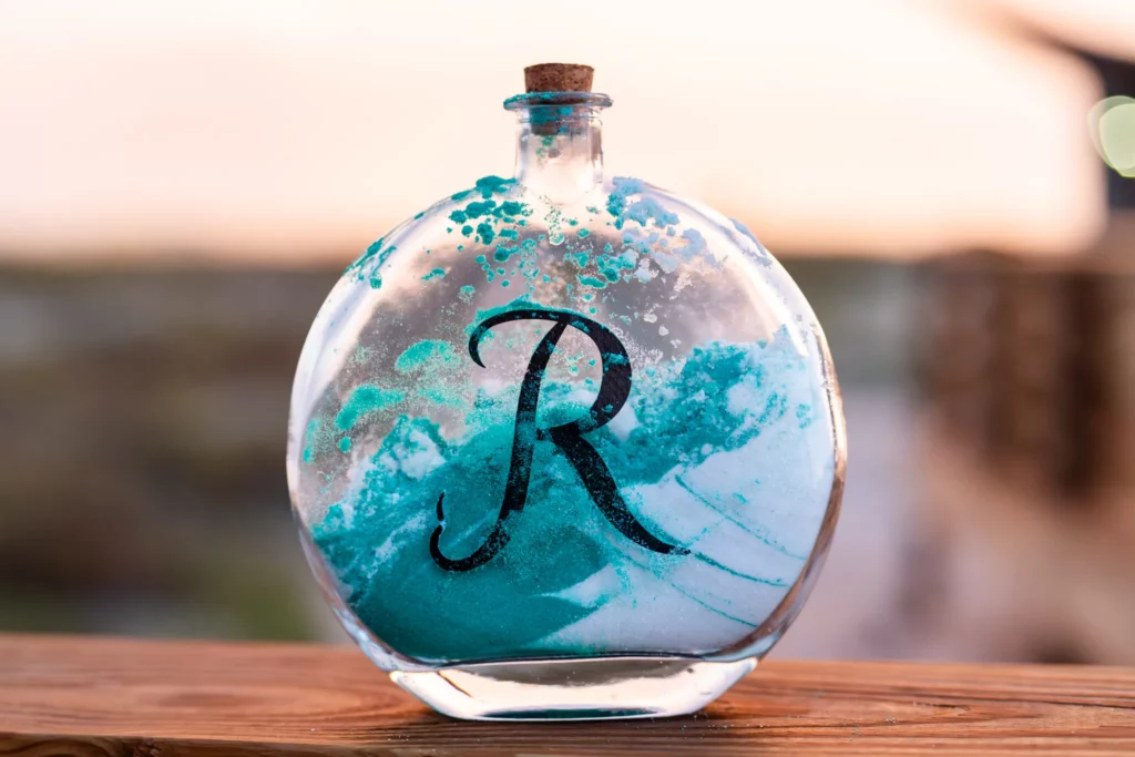 Panama City Beach Wedding Photographer 8 Wedding symbol glass bottle with the letter R, full of turquoise sand