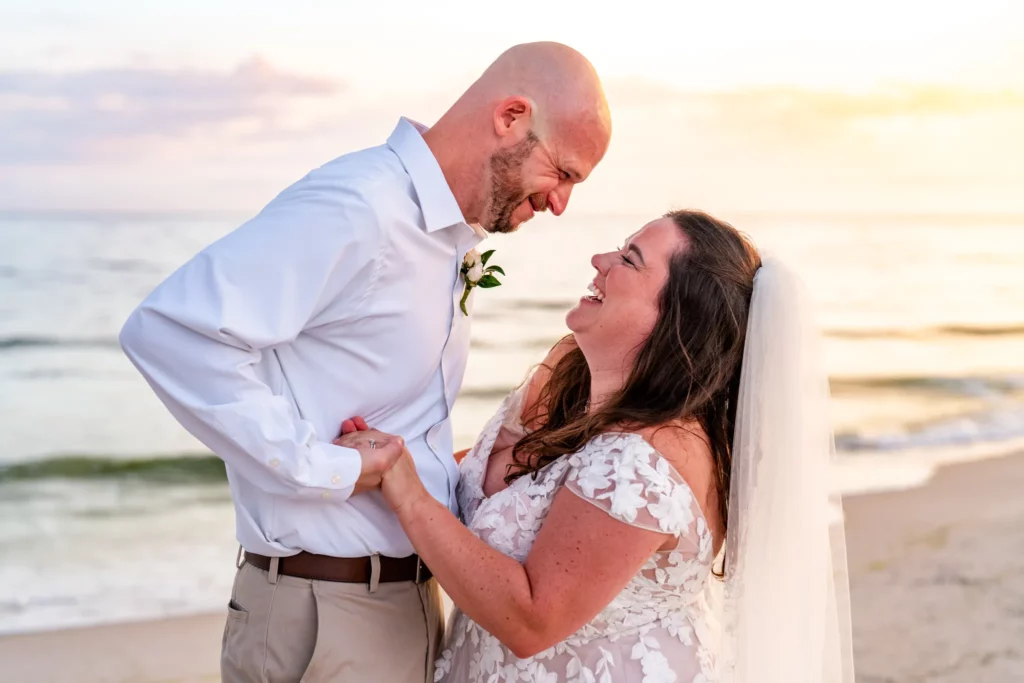 Panama City Beach Wedding Photographer 1 Chad & Rena holding hands and smiling looking into each others eyes after getting married on Orange Beach