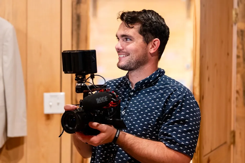 Korbin Henderson - owner: kdh weddings BTS of himself at a wedding taking photographs