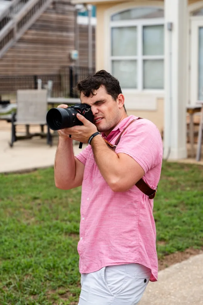 Korbin Henderson - owner: kdh weddings BTS of himself at a wedding taking photographs