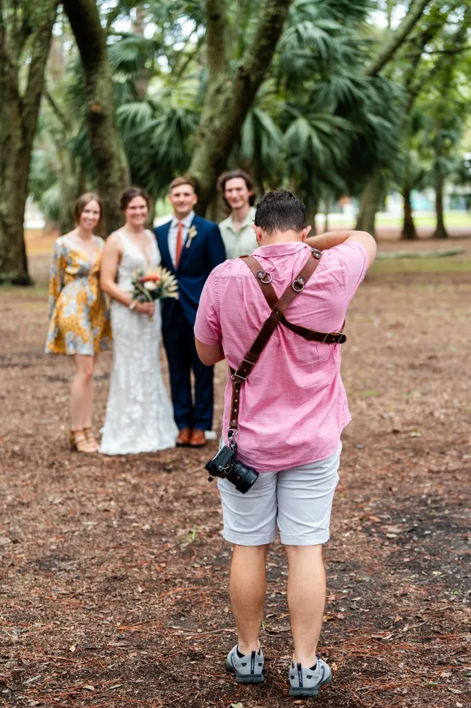 Korbin Henderson - owner: kdh weddings BTS of himself at a wedding taking photographs