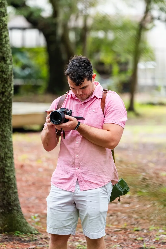 Korbin Henderson - owner: kdh weddings BTS of himself at a wedding taking photographs