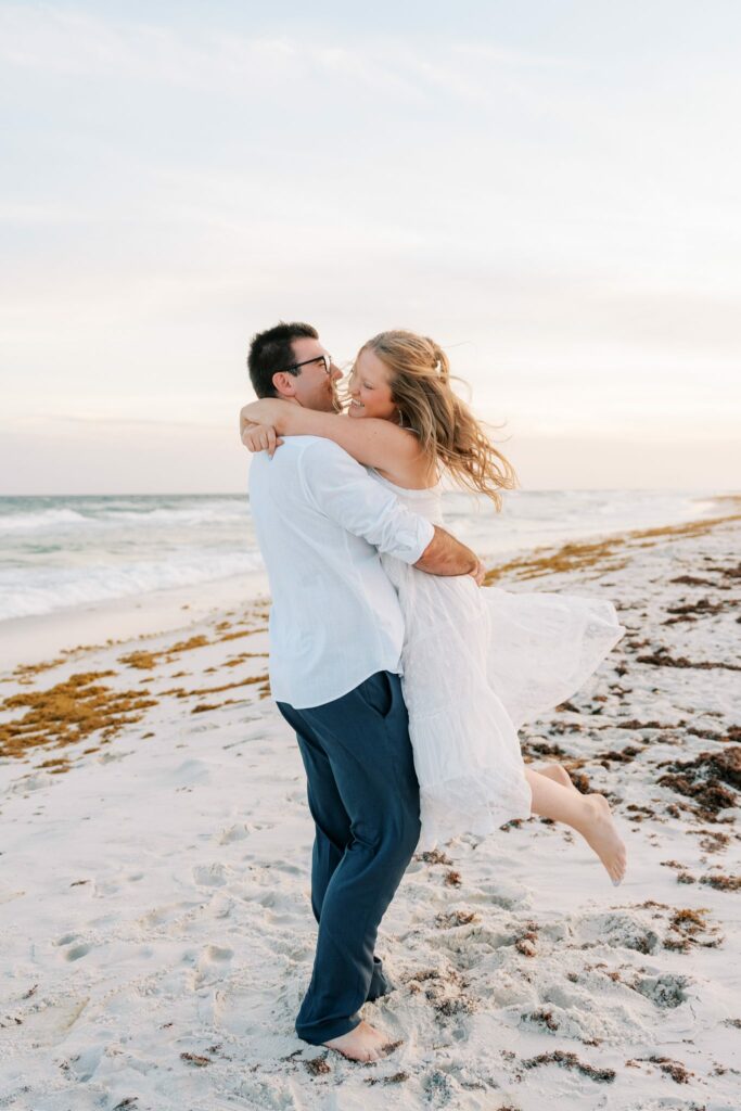 Andrew & Katie's Pensacola Beach Engagement Photos and Film 5 Katie jumps into Andrew's arms at the waterline