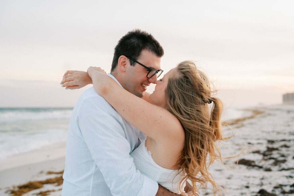 Andrew & Katie's Pensacola Beach Engagement Photos and Film 6 Andrew and Katie nose to nose with the Gulf behind them