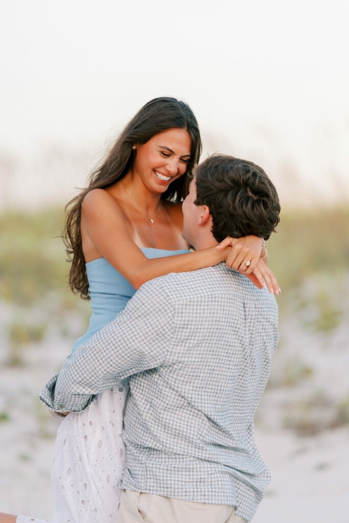 Hayes & Mallory's Surprise Proposal on Pensacola Beach 3 Mallory beams as Hayes hugs her after she says yes