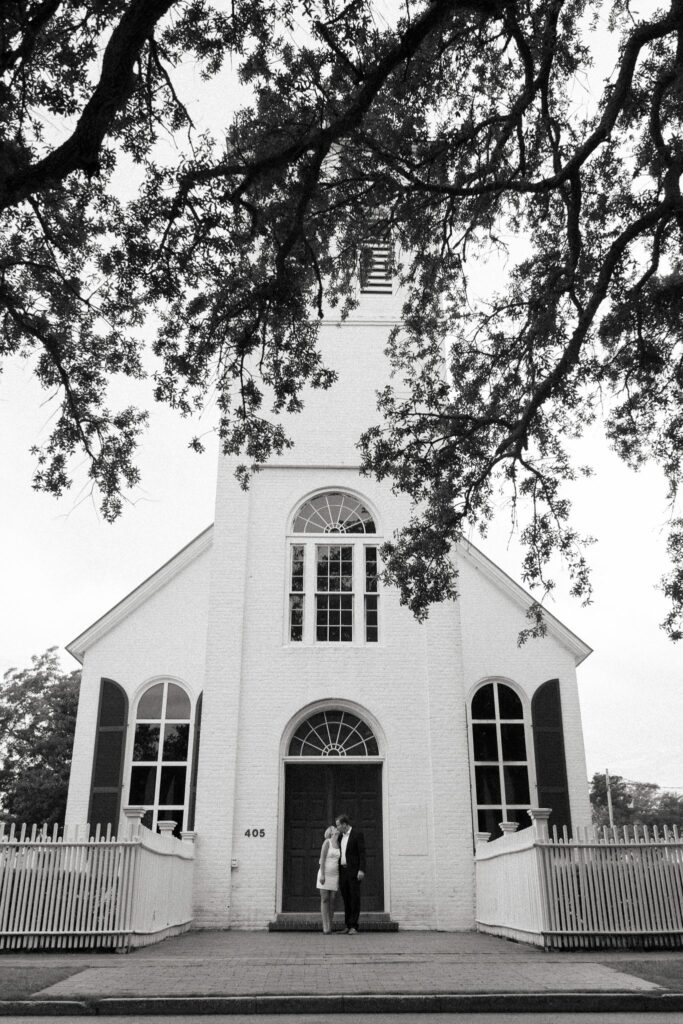 Engaged couple at the front door of Old Christ Church, 405 South Adams Street, on Seville Square in Pensacola