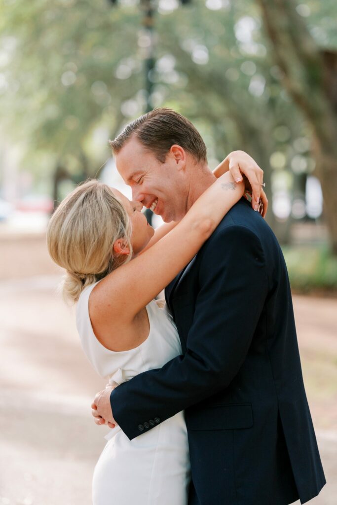 Brooklin wraps her arms around Sean's neck in downtown Pensacola