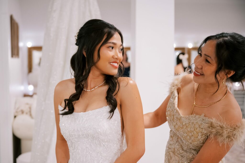 Bret & Ella's Spring Warehouse Wedding in Pensacola 4 Ella smiling with a family member while getting ready