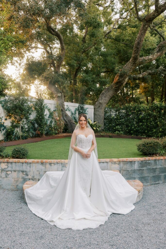 Nick & Amanda's Supposey Warehouse Wedding in Pensacola 9 Amanda's cathedral train spread across the brick steps in the Supposey garden