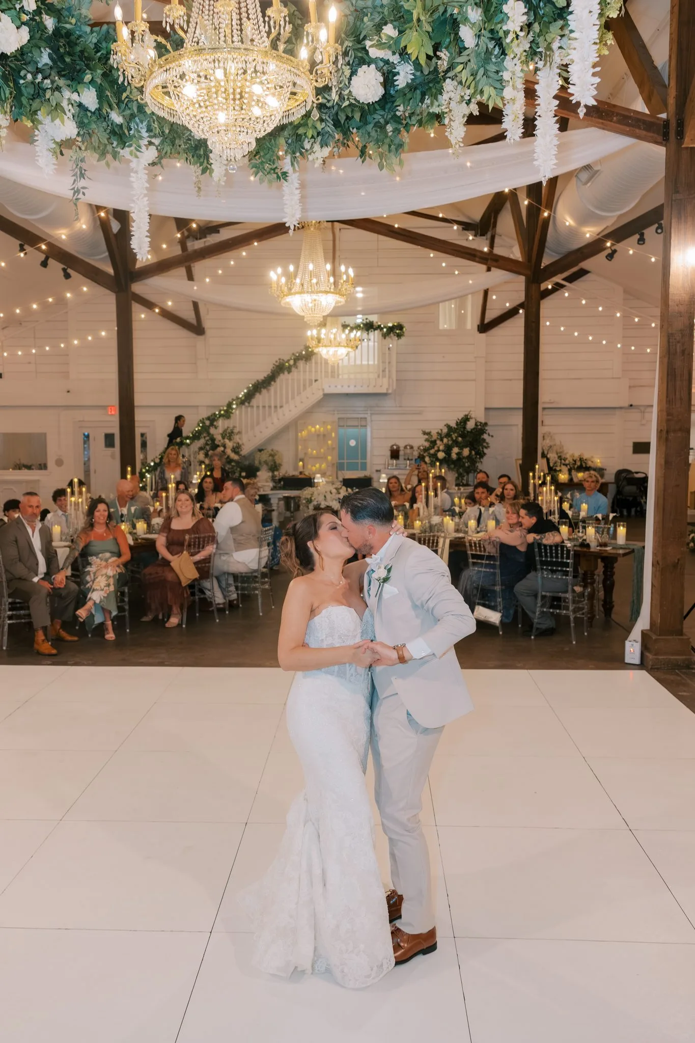 Pensacola Wedding Photographer - KDH Weddings 7 First dance under crystal chandeliers and wood beams in the Supposey ballroom