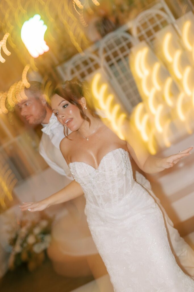 Nick & Amanda's Supposey Warehouse Wedding in Pensacola 14 Amanda dancing in motion blur on the Supposey dance floor