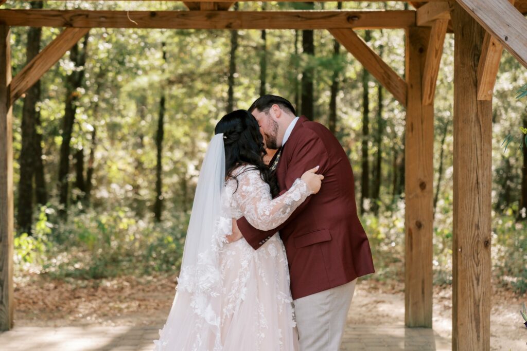 Jacob & Angelina's Holland Farms Wedding 6 Jacob and Angelina's first kiss under the timber pavilion at Holland Farms in Milton, Florida