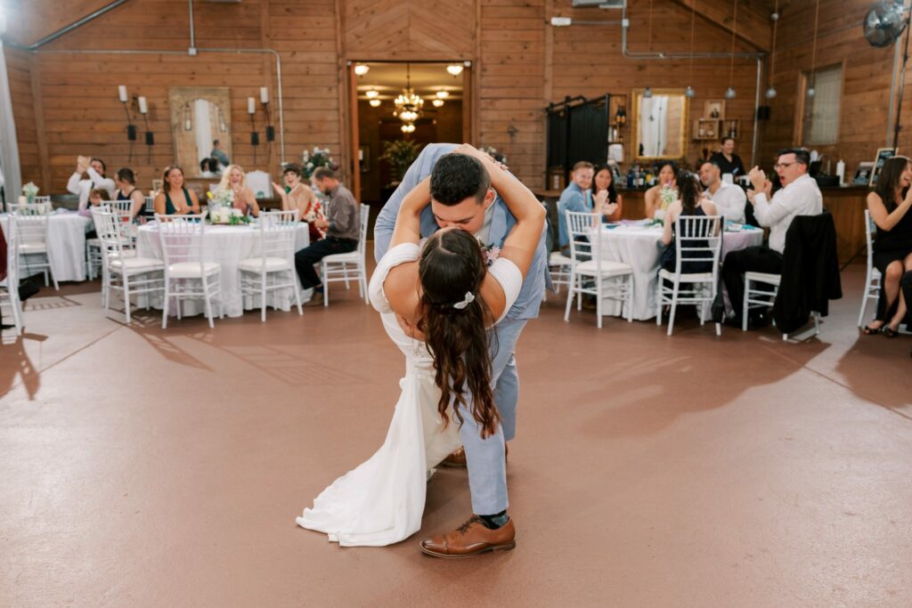 Brandon & Victoria's Laurel Hill Farm Wedding 14 Brandon dips Victoria during their first dance in the wood-paneled reception hall