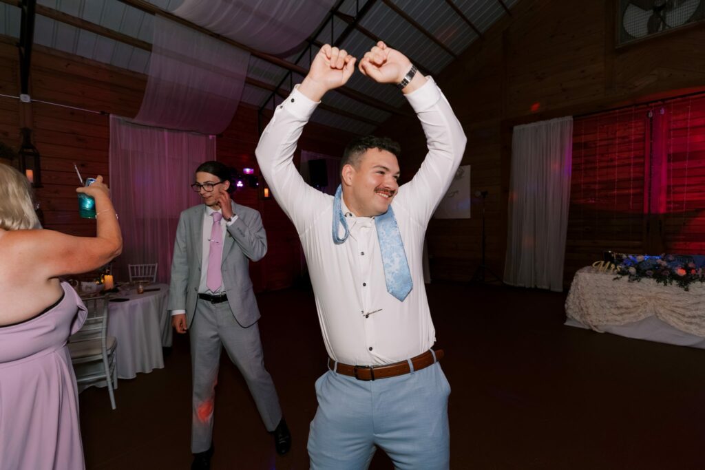 Brandon & Victoria's Laurel Hill Farm Wedding 17 Brandon dancing with his tie around his head at the reception