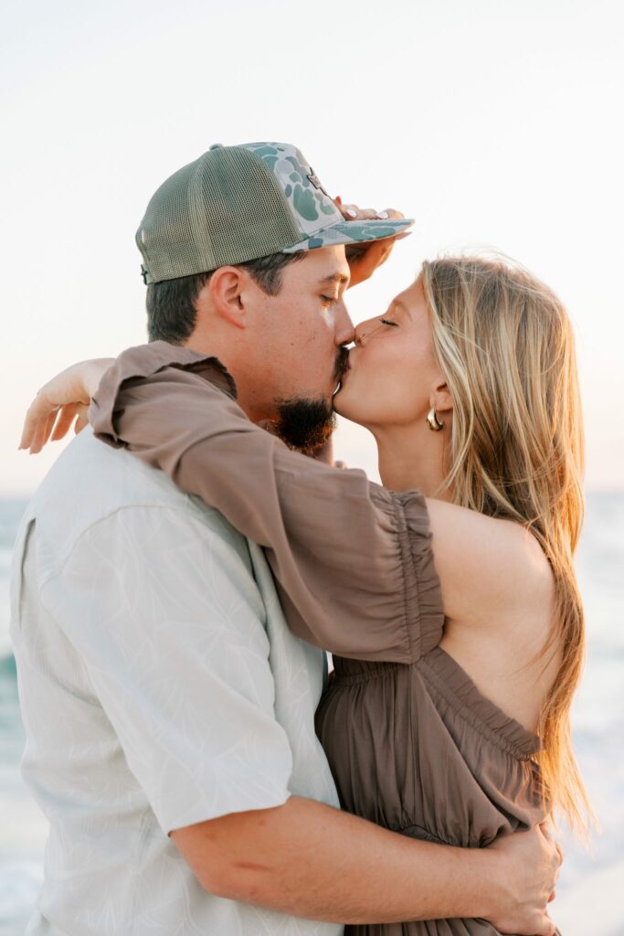 Avery & Hannah's Orange Beach Proposal 6 Avery and Hannah kiss on Orange Beach, Alabama, during their sunset engagement session