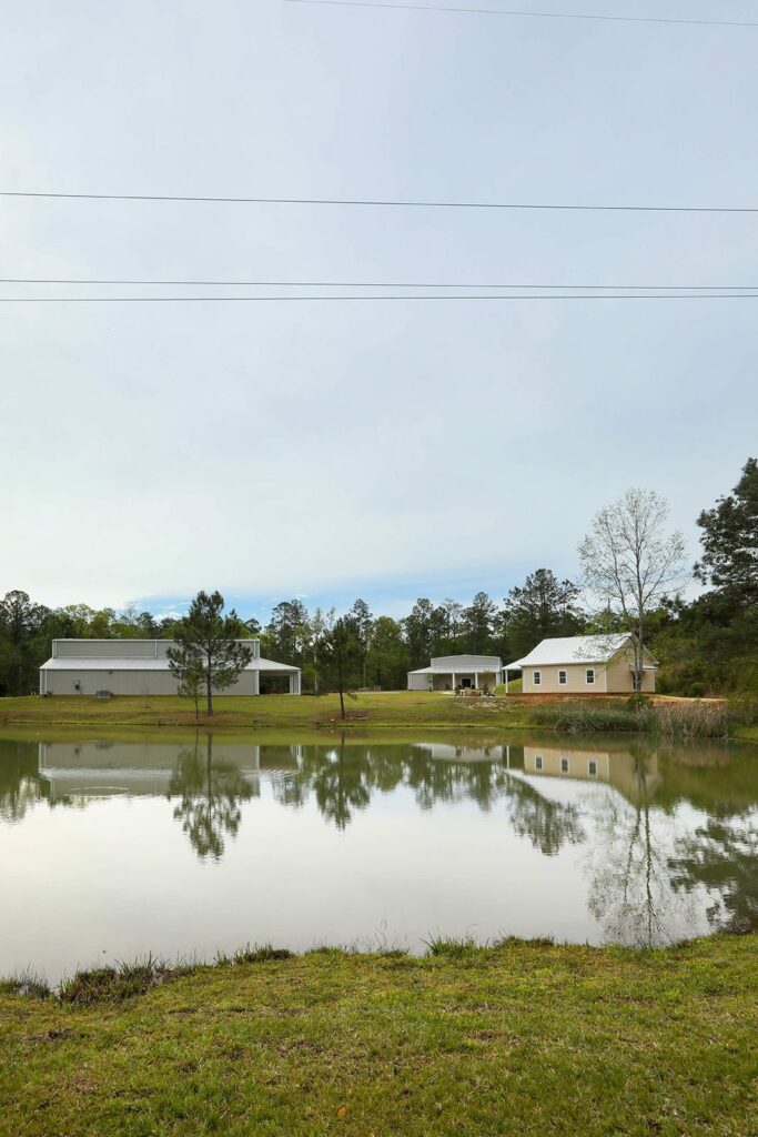 Anthony & Renee's Wedding at The Venue at Hidden Falls 17 The pond at The Venue at Hidden Falls with the venue buildings reflected in the water
