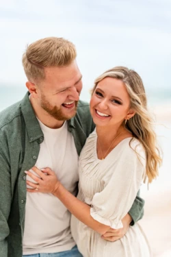 Rainy Day Romance: Joe & Tarah's Stunning Pensacola Beach Engagement Session 21 a man and woman smiling at each other on Pensacola Beach during their Engagement Photo Shoot by KDH Weddings