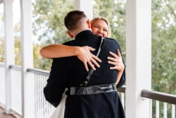 A Perfect USMC Wedding in Pensacola – Bobby & Kaisey’s Big Day 22 groom in dress blues first look at bride hugging