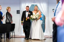 A Perfect USMC Wedding in Pensacola – Bobby & Kaisey’s Big Day 29 father in dress blues walking bride down the aisle