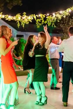 A Perfect USMC Wedding in Pensacola – Bobby & Kaisey’s Big Day 34 women on dance floor at wedding partying arms up