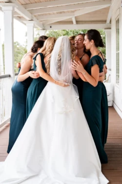 A Perfect USMC Wedding in Pensacola – Bobby & Kaisey’s Big Day 17 bride and bridesmaids hugging