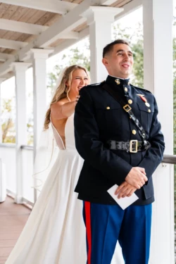 A Perfect USMC Wedding in Pensacola – Bobby & Kaisey’s Big Day 19 bride behind usmc dress blues husband about to do the reveal