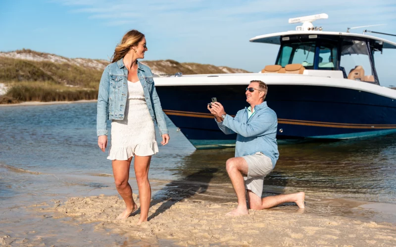 Ethan & Kim Proposal Shoot in Pensacola KDH Weddings209933 Ethan proposes to Kim on pensacola beach, Ethan on one knee, Kim turns around baffled and surprised